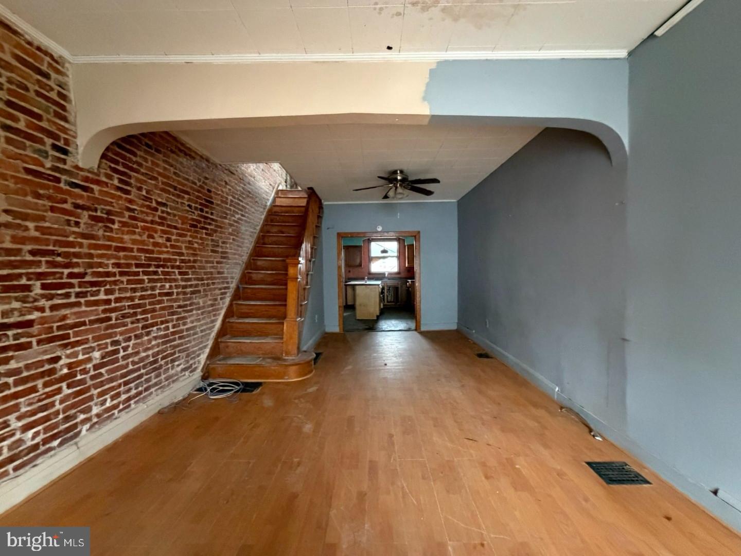 12 South Kresson Street Baltimore, MD 21224 - Photo 4 of 29 a view of empty room with wooden floor
