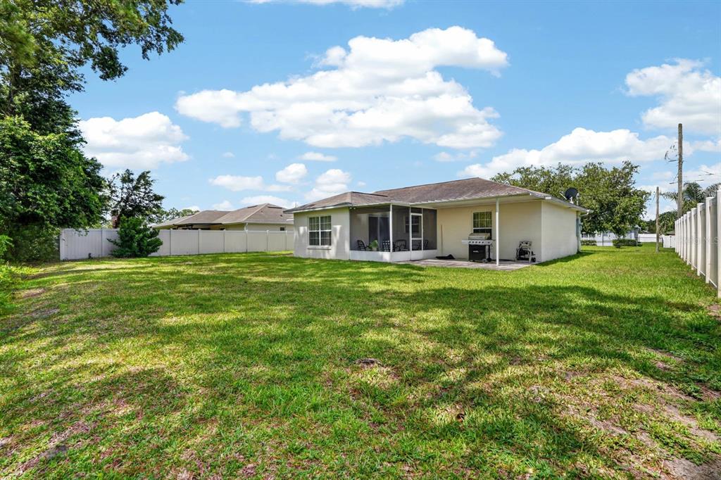 80 Roxboro Drive Palm Coast, FL 32164 - Photo 25 of 39 a view of a house with a backyard