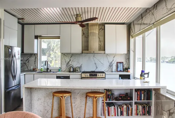 a kitchen with appliances cabinets and a sink