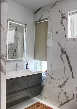 a bathroom with a bathtub and a sink