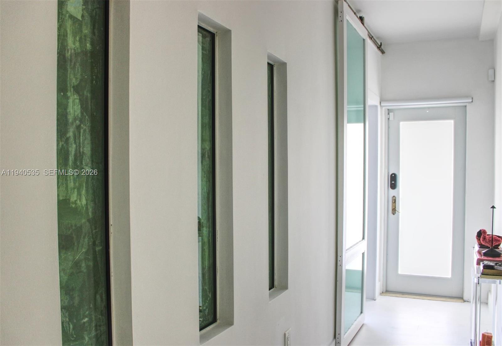 4710 Pine Tree Drive, Unit 49 Miami Beach, FL 33140 - Photo 20 of 26 a view of a bathroom from the hallway