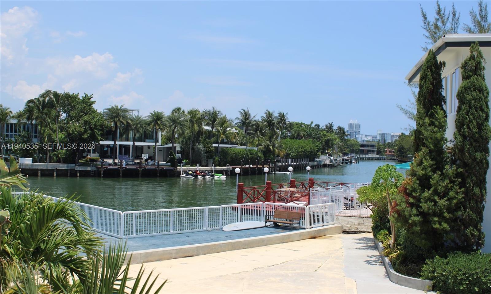 4710 Pine Tree Drive, Unit 49 Miami Beach, FL 33140 - Photo 21 of 26 a view of a lake with sitting area