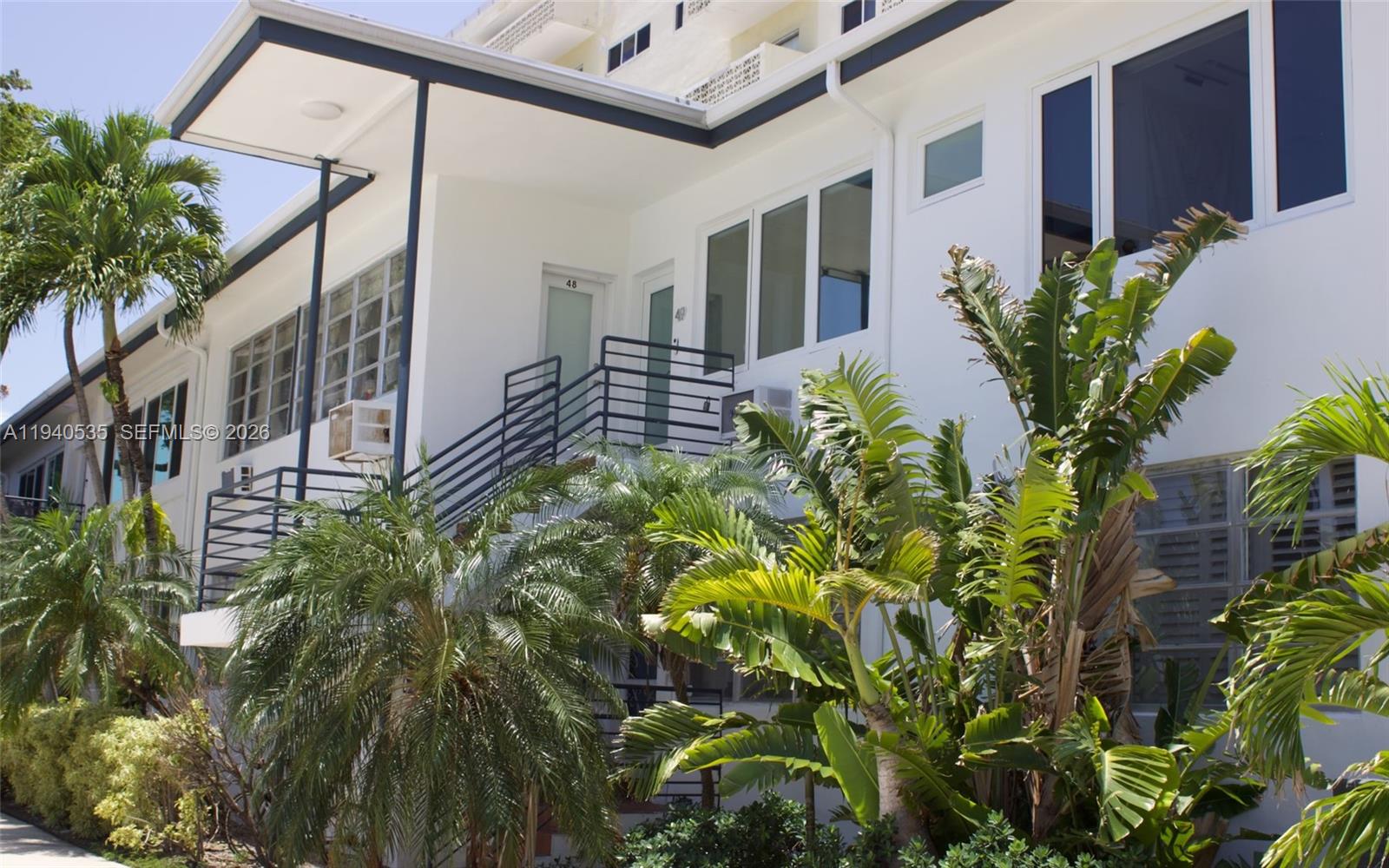 4710 Pine Tree Drive, Unit 49 Miami Beach, FL 33140 - Photo 22 of 26 a plant is in front of a house