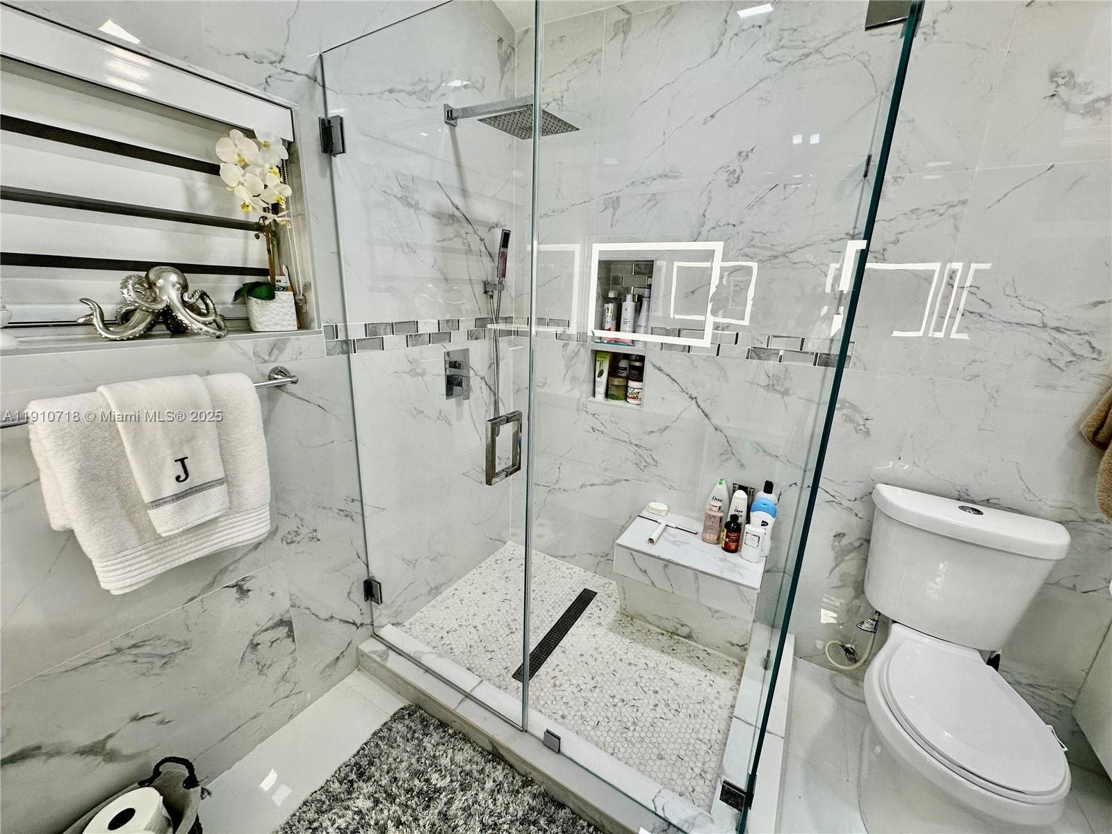5259 Northwest 184th Lane Miami Gardens, FL 33055 - Photo 12 of 32 a bathroom with a toilet sink and shower