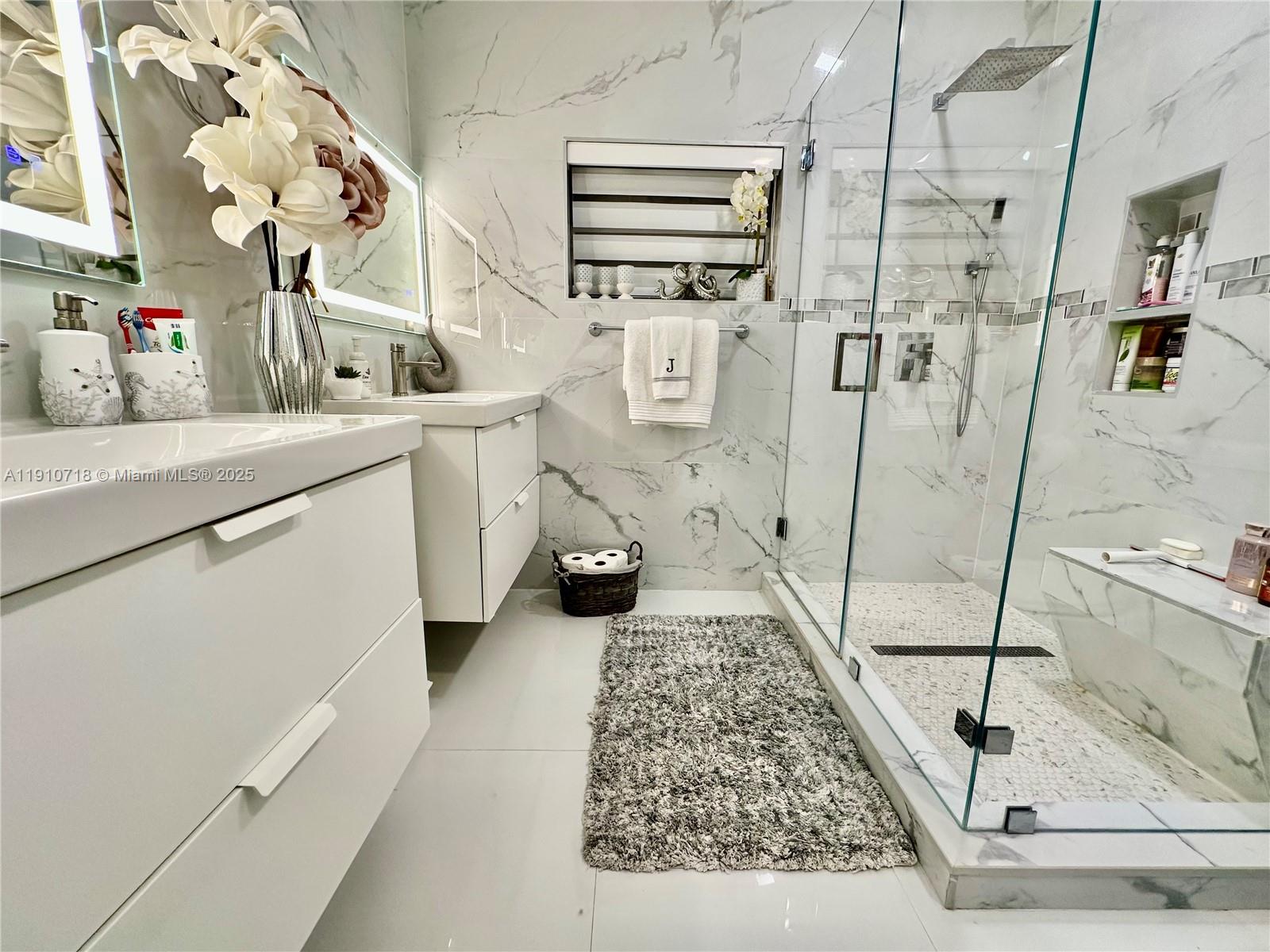 5259 Northwest 184th Lane Miami Gardens, FL 33055 - Photo 13 of 32 a bathroom with a sink a toilet and shower