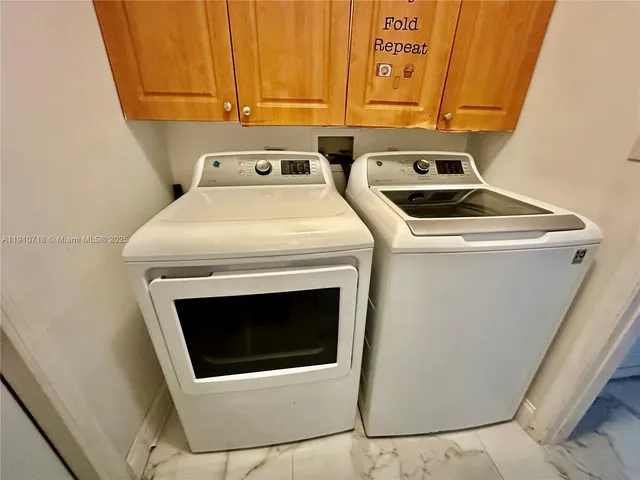 a kitchen with a stove a sink and a microwave