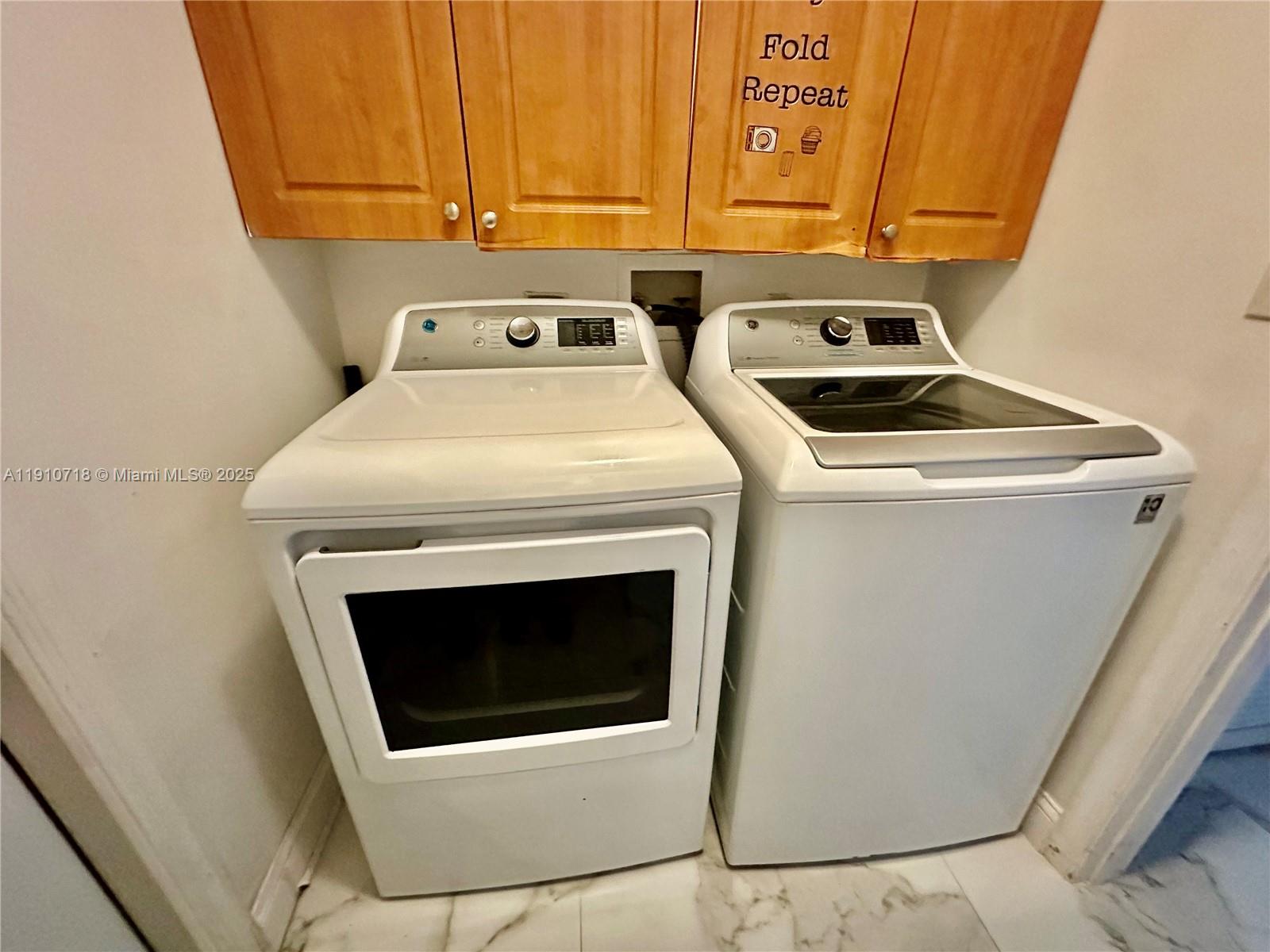 5259 Northwest 184th Lane Miami Gardens, FL 33055 - Photo 18 of 32 a utility room with dryer and washer