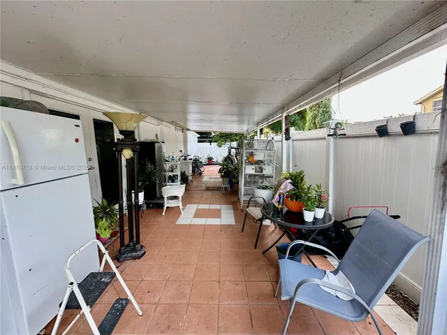 a kitchen with sink stove and refrigerator