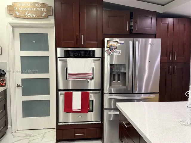 a view of swimming pool with outdoor seating and plants