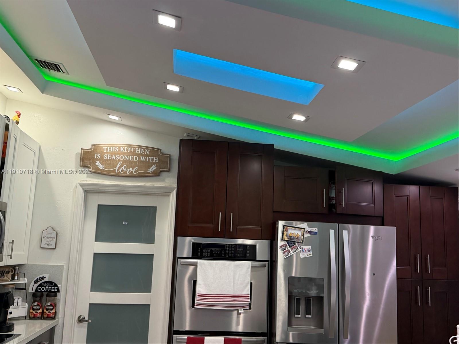 5259 Northwest 184th Lane Miami Gardens, FL 33055 - Photo 29 of 32 a kitchen with stainless steel appliances a refrigerator and a stove top oven