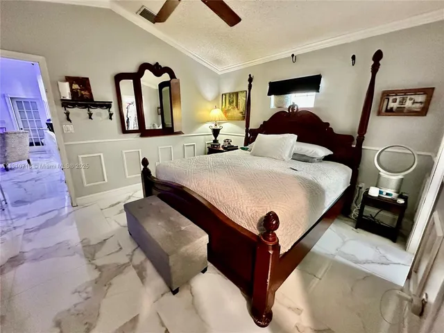 a bed room with a bed and dresser