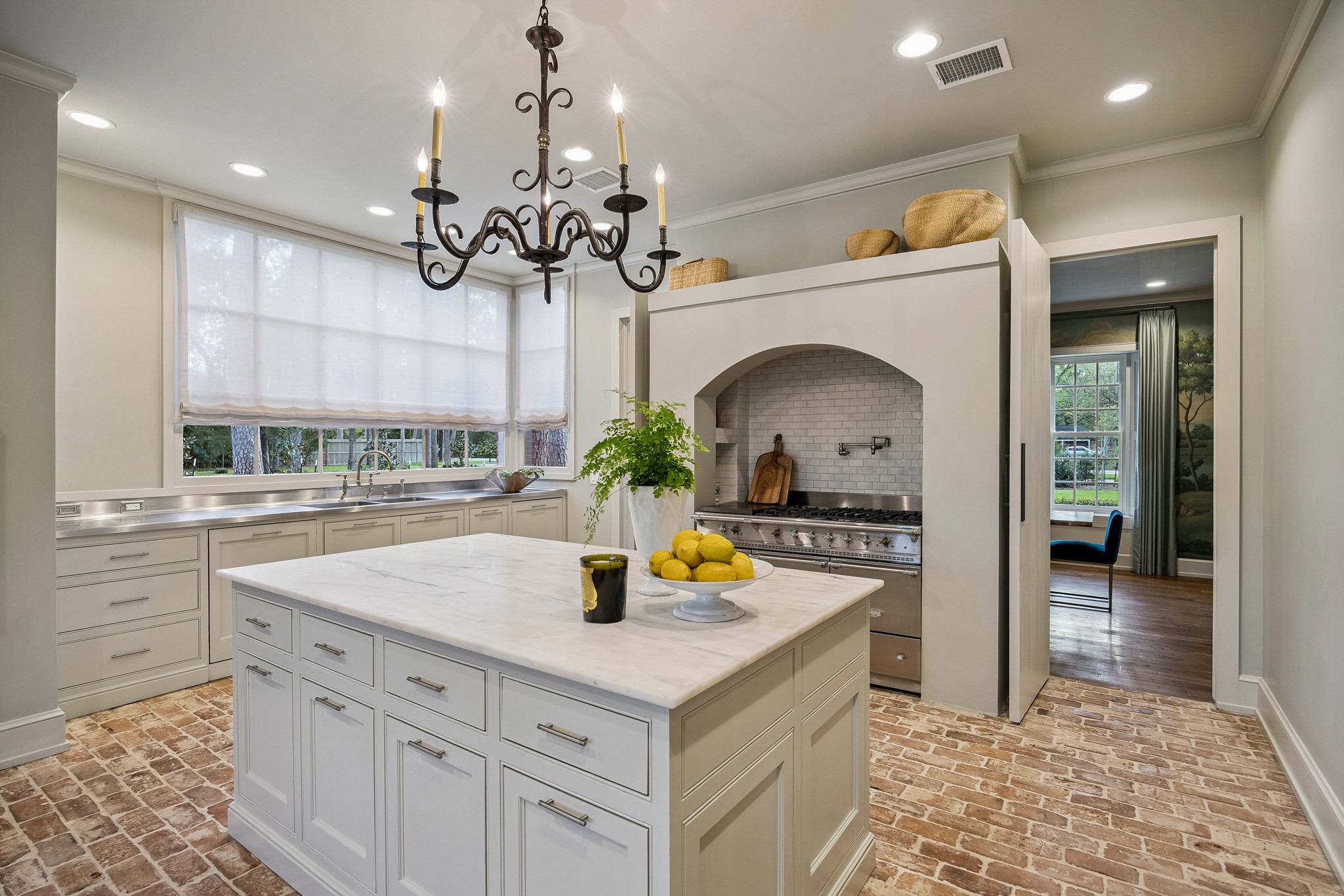 448 Blalock Road Houston, TX 77024 - Photo 12 of 49 a kitchen with a sink a stove and cabinets