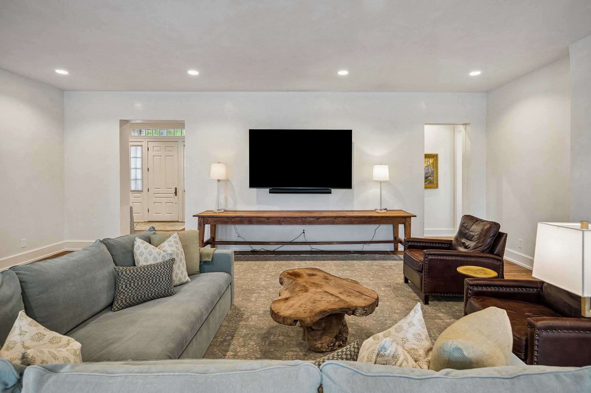 448 Blalock Road Houston, TX 77024 - Photo 18 of 49 a living room with furniture and a flat screen tv