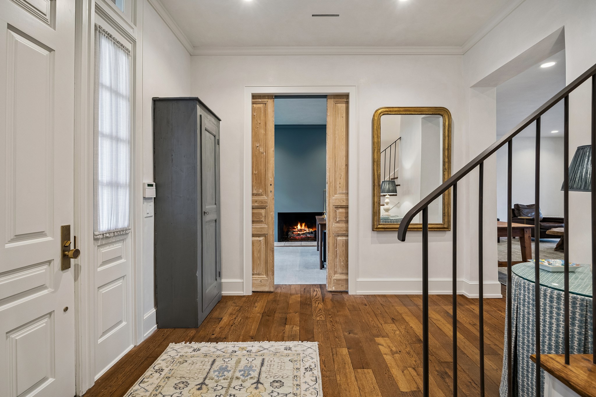 448 Blalock Road Houston, TX 77024 - Photo 19 of 49 a view of a hallway with wooden floor and staircase
