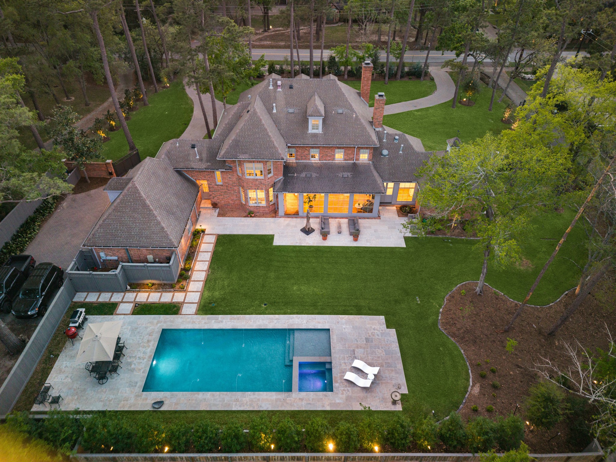 448 Blalock Road Houston, TX 77024 - Photo 2 of 49 an aerial view of a house with swimming pool lawn chairs and a yard