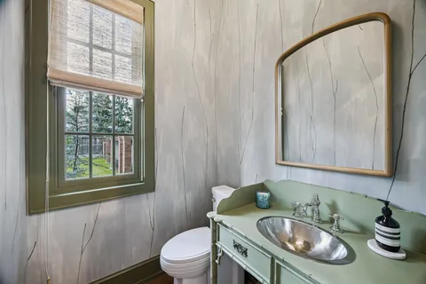 a bedroom with a bed and large window