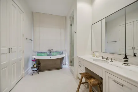 a bathroom with a tub and shower