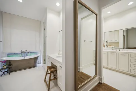 a bathroom with a double vanity sink and mirror