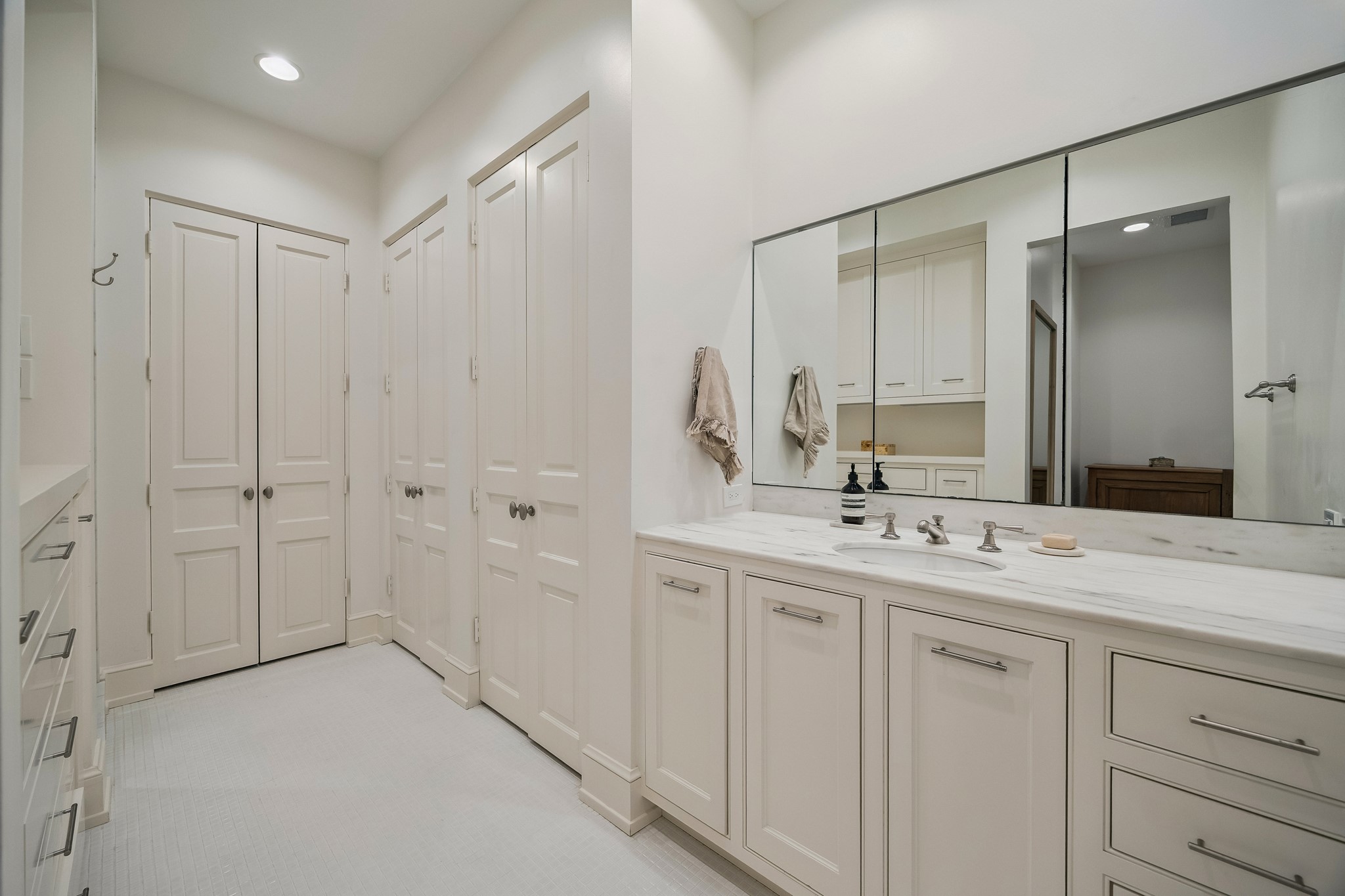 448 Blalock Road Houston, TX 77024 - Photo 27 of 49 a bathroom with a double vanity sink and mirror