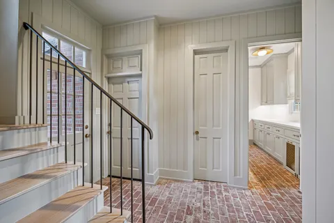 a bathroom with a tub and a window