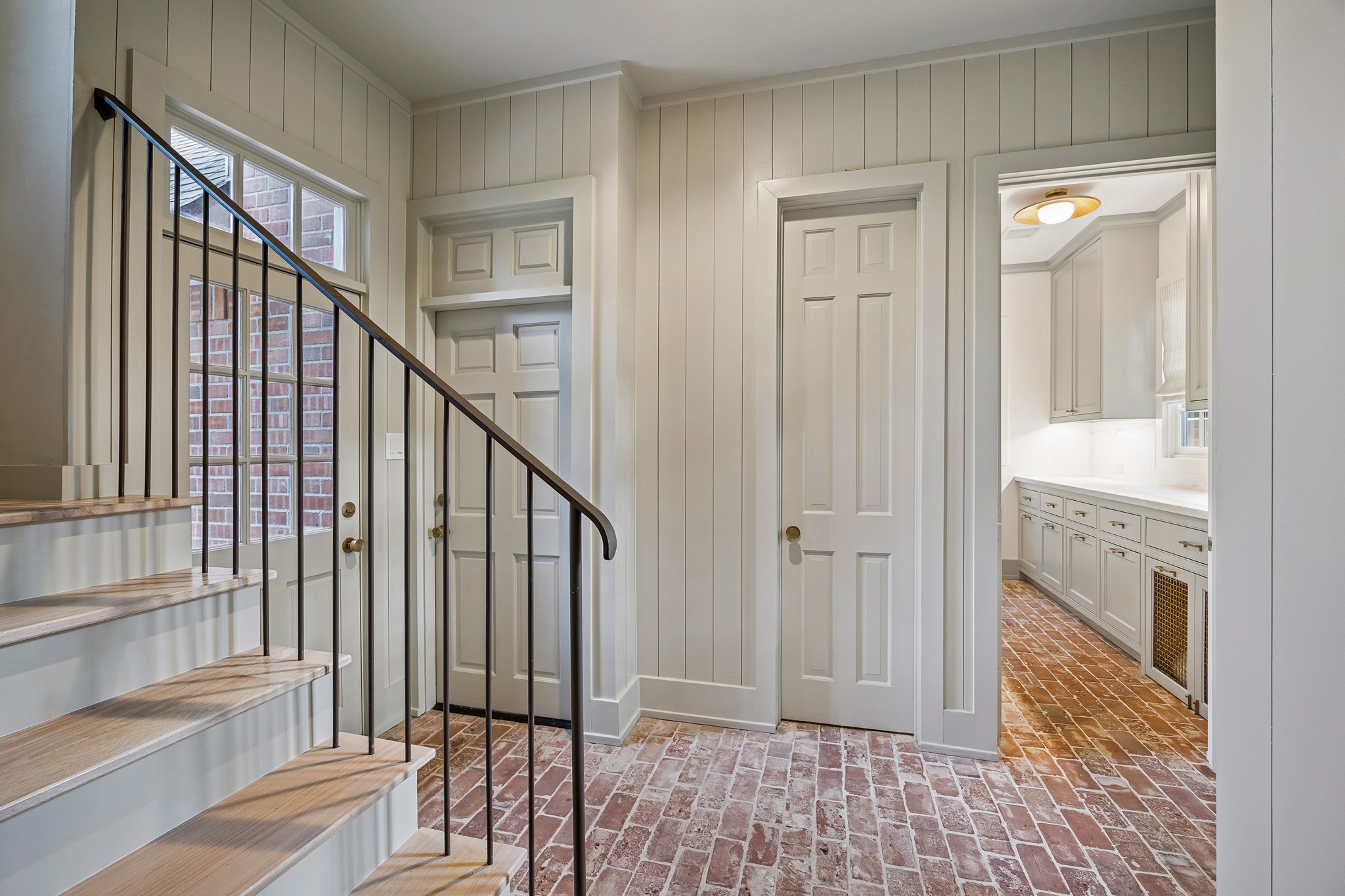 448 Blalock Road Houston, TX 77024 - Photo 28 of 49 a view of a hallway with wooden floor and staircase