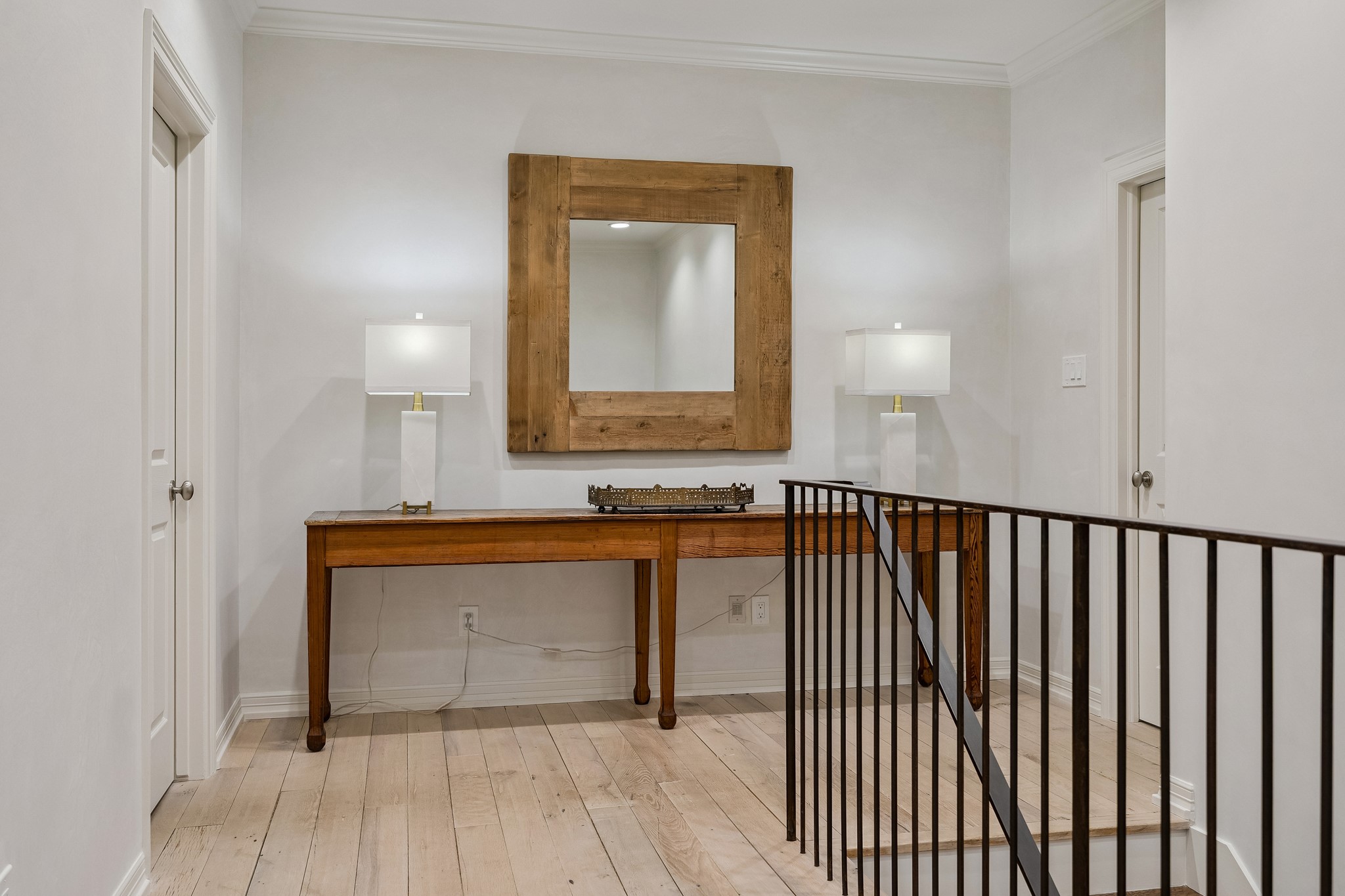 448 Blalock Road Houston, TX 77024 - Photo 30 of 49 a view of a hallway with wooden floor and staircase