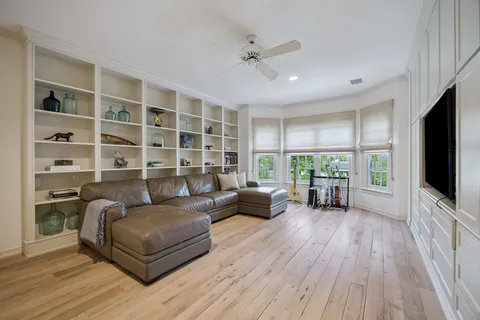 a spacious bedroom with a bed and a window