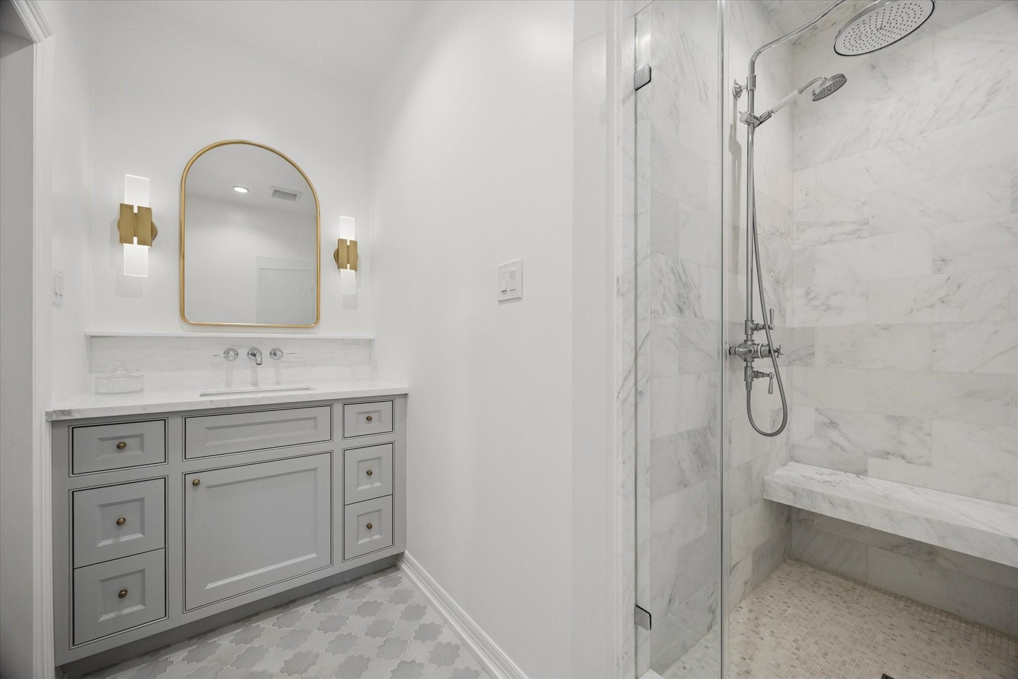 448 Blalock Road Houston, TX 77024 - Photo 33 of 49 a bathroom with a granite countertop sink a toilet and a mirror