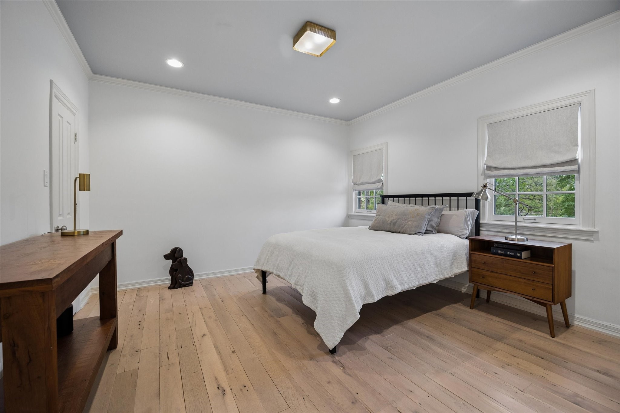 448 Blalock Road Houston, TX 77024 - Photo 34 of 49 a bedroom with a bed and a window