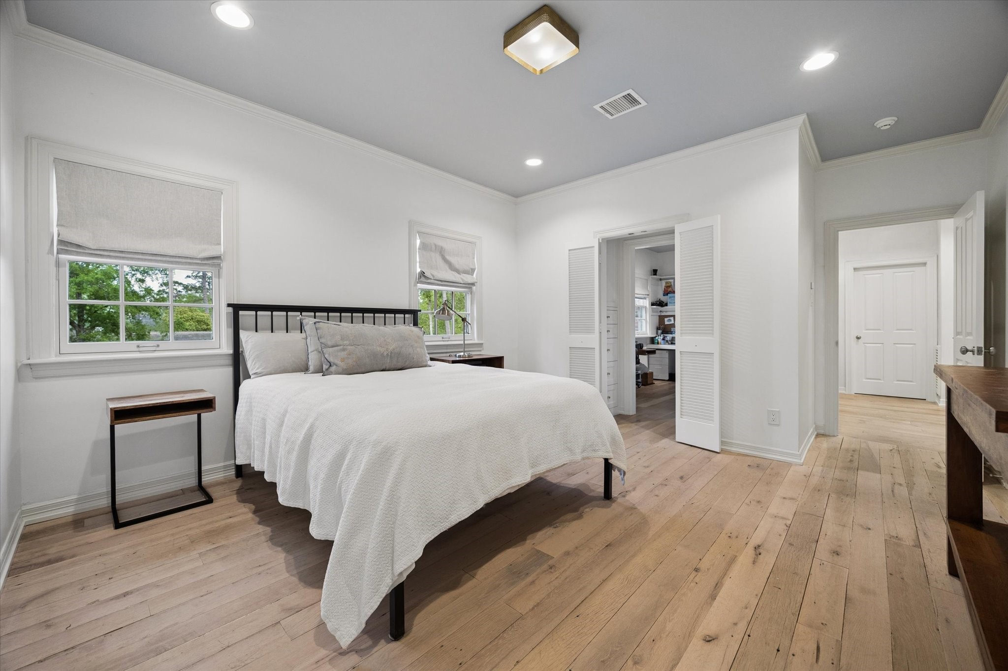 448 Blalock Road Houston, TX 77024 - Photo 35 of 49 a bedroom with a large bed and a window