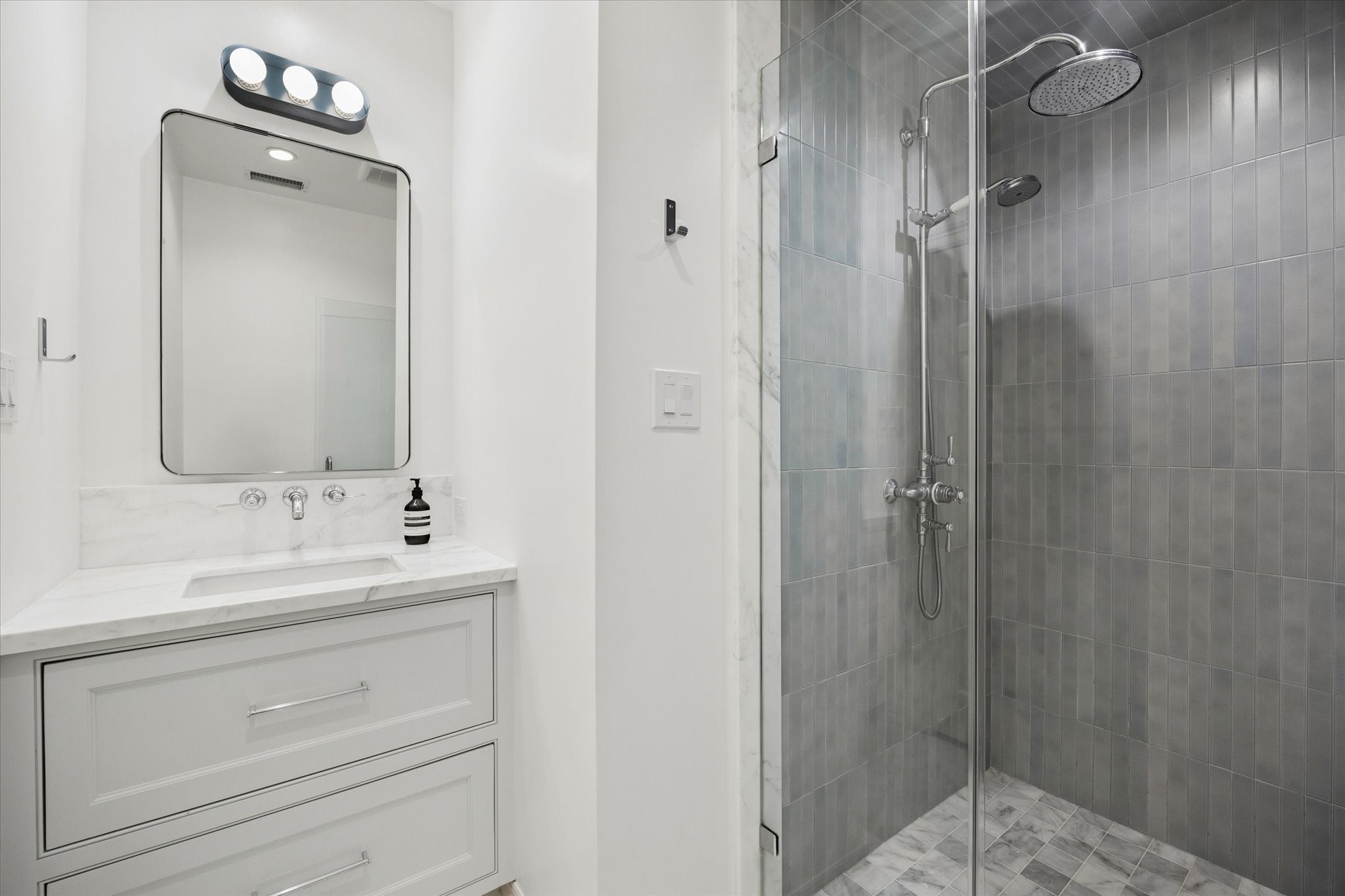 448 Blalock Road Houston, TX 77024 - Photo 36 of 49 a bathroom with a double vanity sink mirror and shower