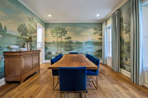 a outdoor sitting area with furniture and wooden floor