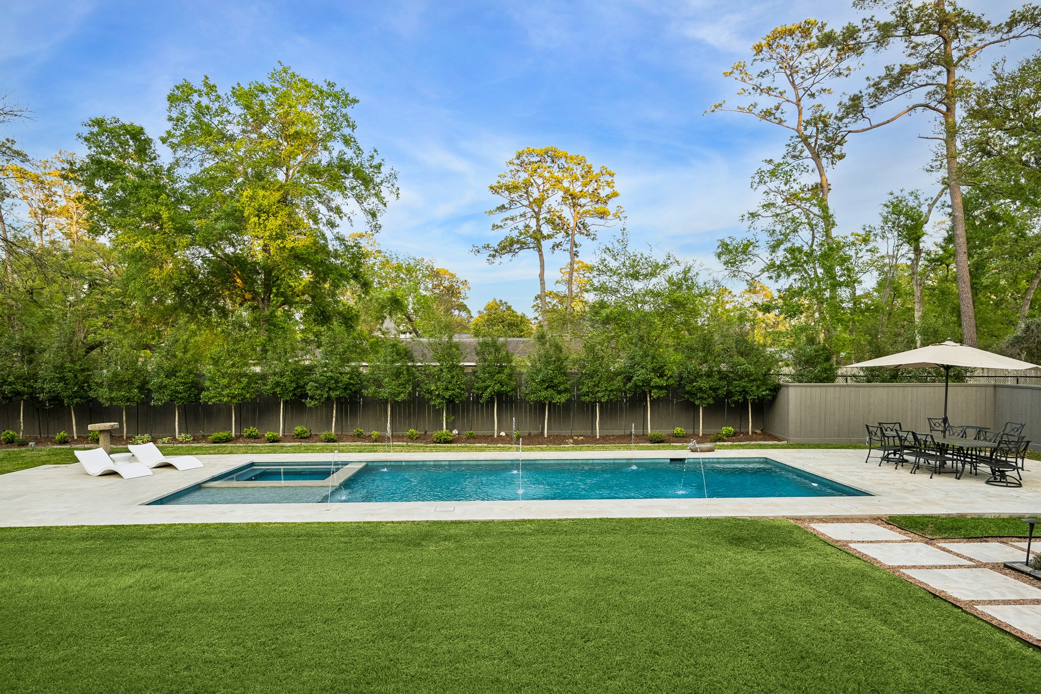 448 Blalock Road Houston, TX 77024 - Photo 43 of 49 a swimming pool with outdoor seating and yard