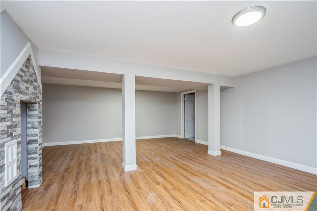 36 Princeton Road Old Bridge, NJ 08859 - Photo 15 of 19 an empty room with wooden floor and windows