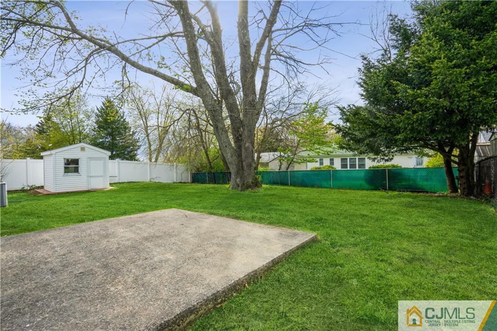 36 Princeton Road Old Bridge, NJ 08859 - Photo 18 of 19 a view of a backyard with large trees
