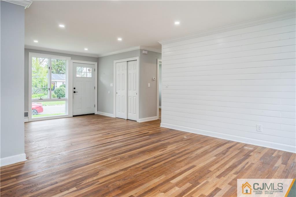 36 Princeton Road Old Bridge, NJ 08859 - Photo 7 of 19 a view of an empty room with wooden floor and a window
