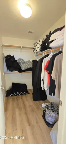 a bathroom with a bathtub and a chandelier