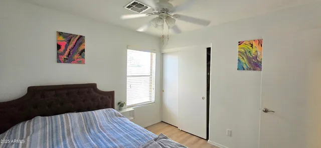 a bedroom with a bed and a dresser