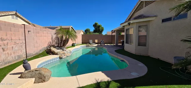 a front view of house with green garden