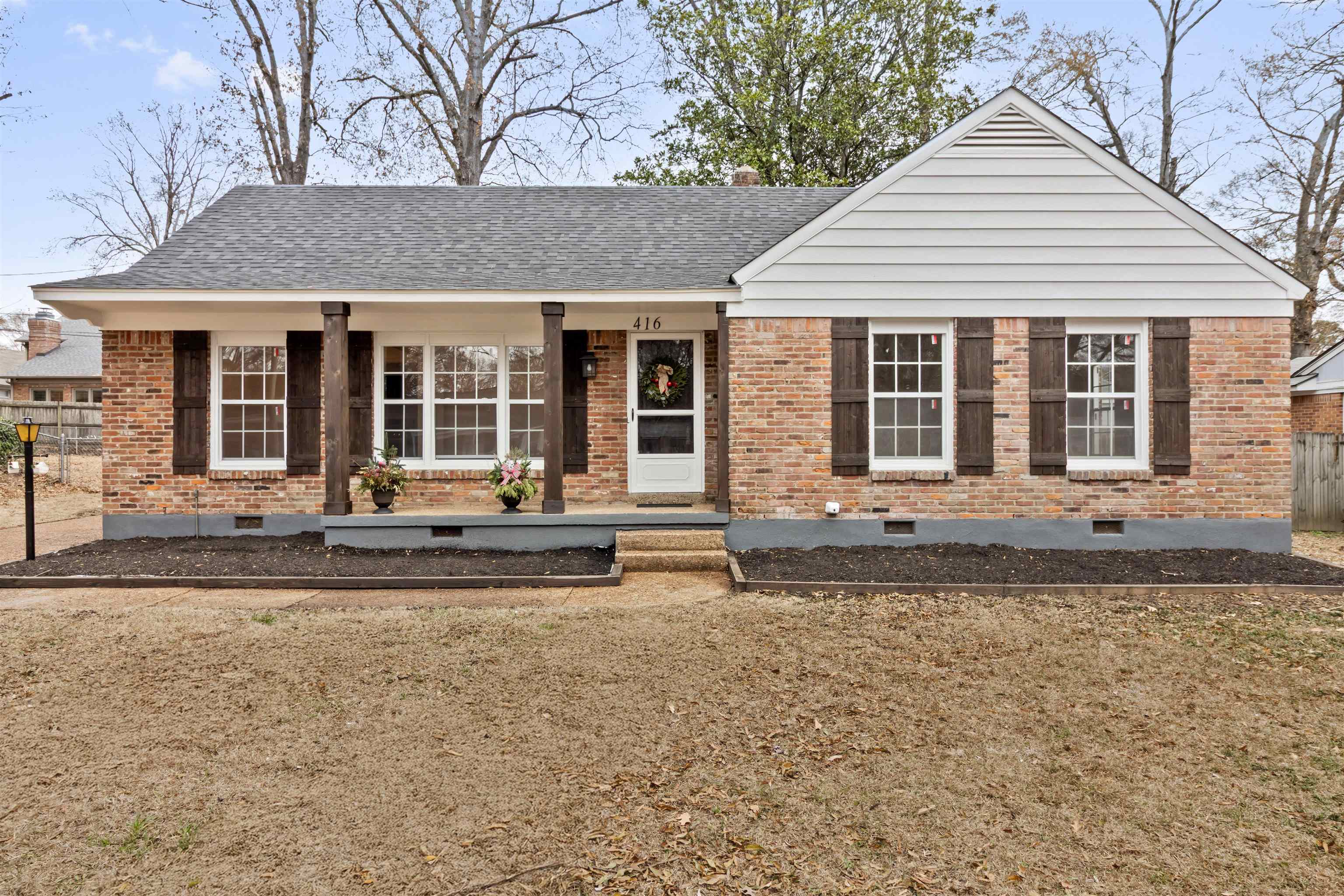 front view of a house with a yard