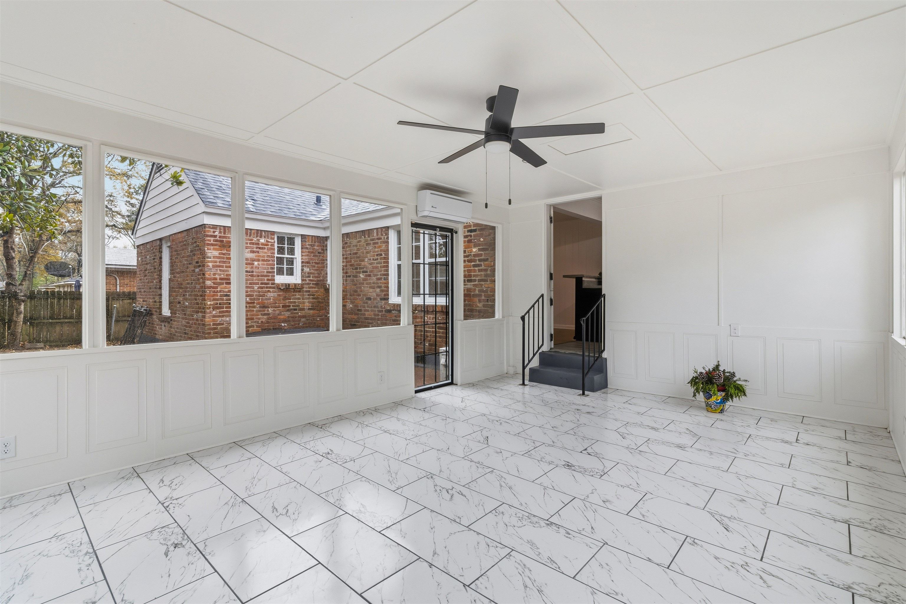 416 Rosser Road Memphis, TN 38120 - Photo 15 of 30 a view of empty room with wooden floor and fan