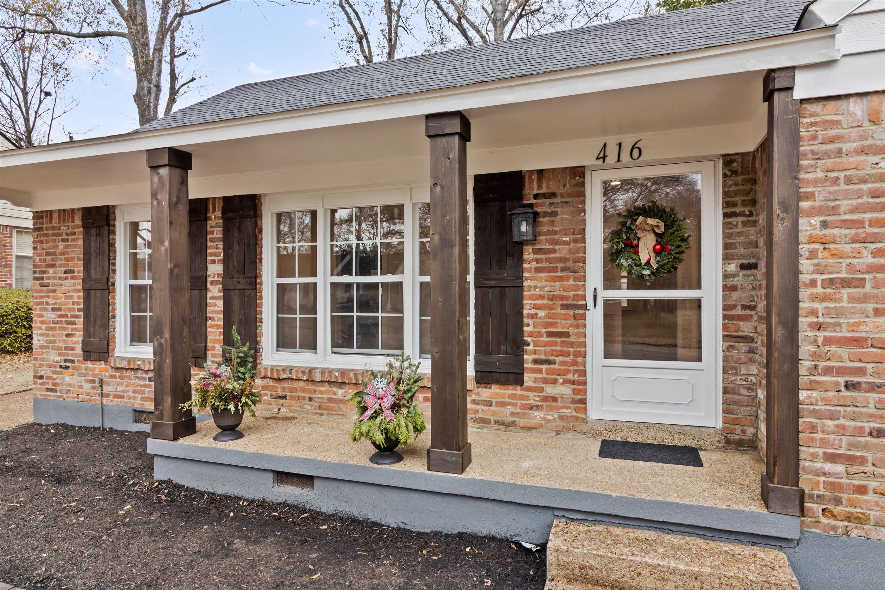 416 Rosser Road Memphis, TN 38120 - Photo 3 of 30 a front view of a house with a porch