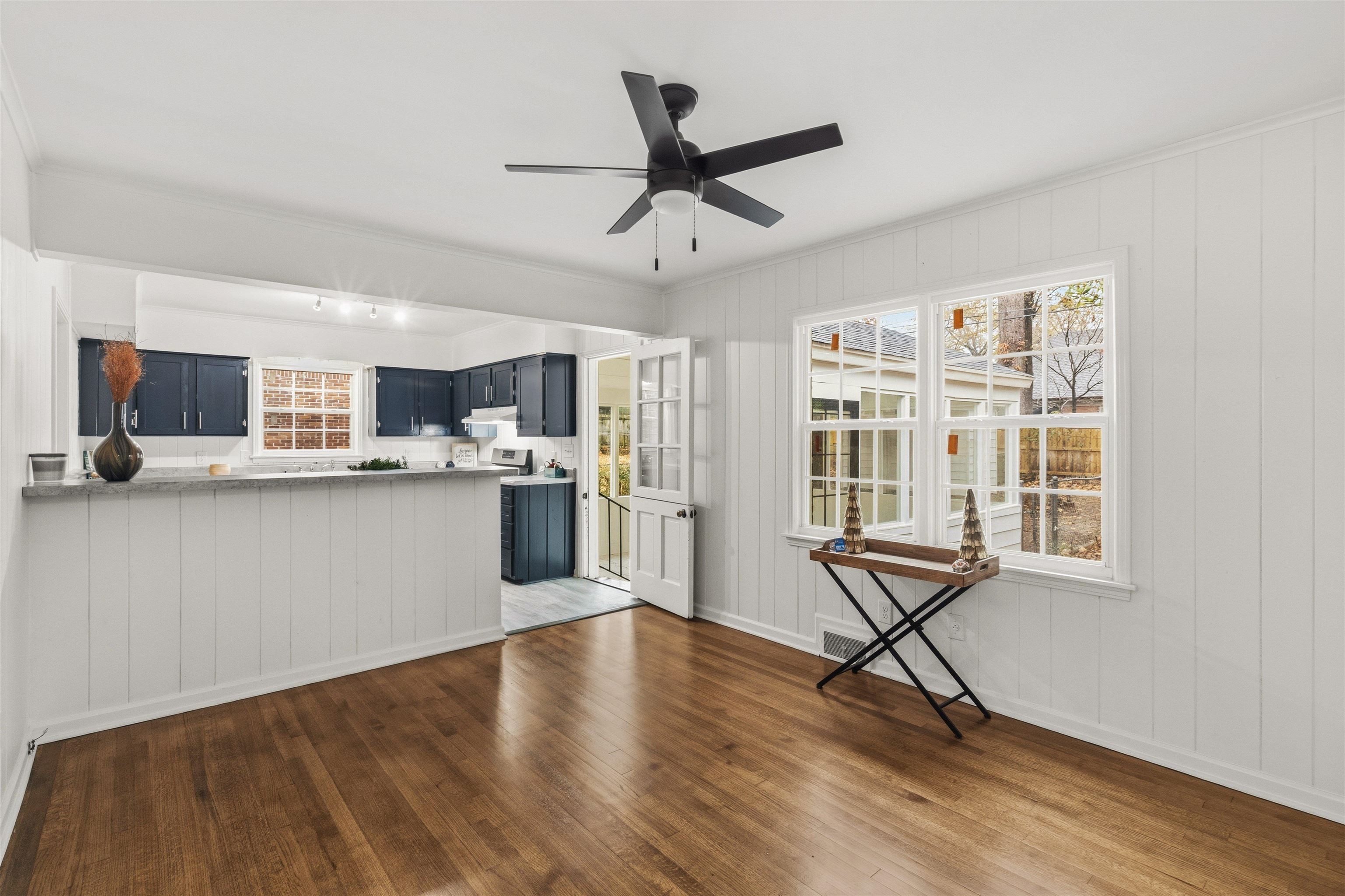 416 Rosser Road Memphis, TN 38120 - Photo 7 of 30 a open kitchen with cabinets wooden floor and a dining table