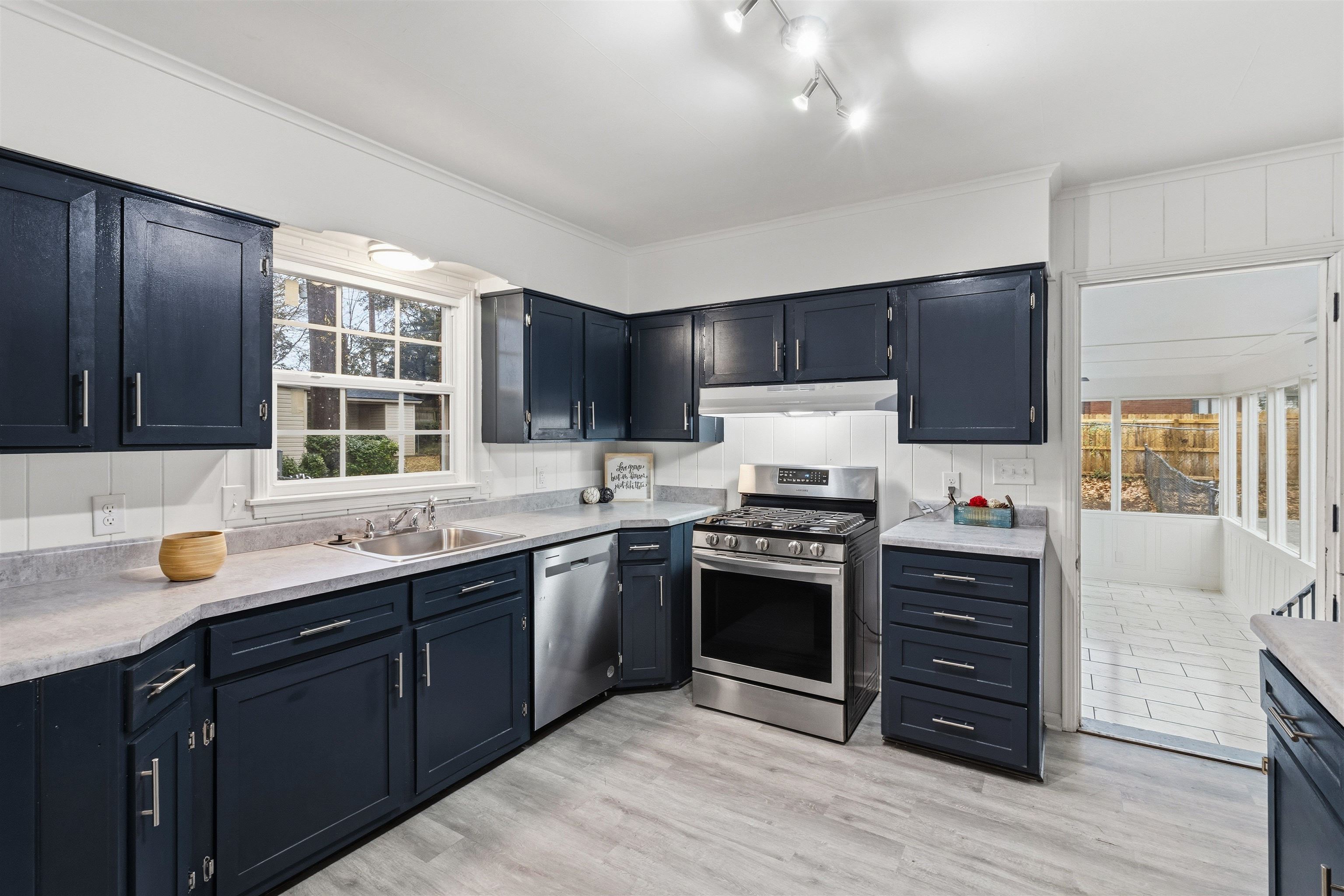 416 Rosser Road Memphis, TN 38120 - Photo 10 of 30 a kitchen with stainless steel appliances granite countertop a sink stove and refrigerator
