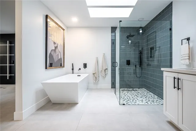 a bathroom with a bathtub and shower