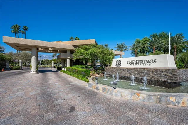 a view of a sign board with a yard