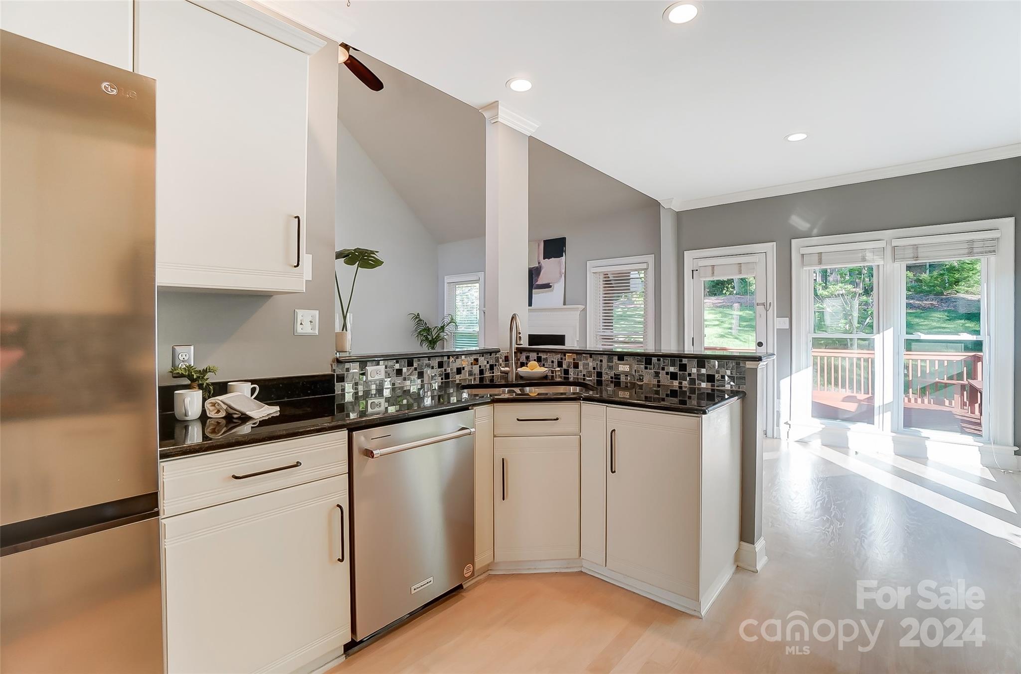 657 Portpatrick Place Fort Mill, SC 29708 - Photo 14 of 46 a kitchen with white cabinets and appliances