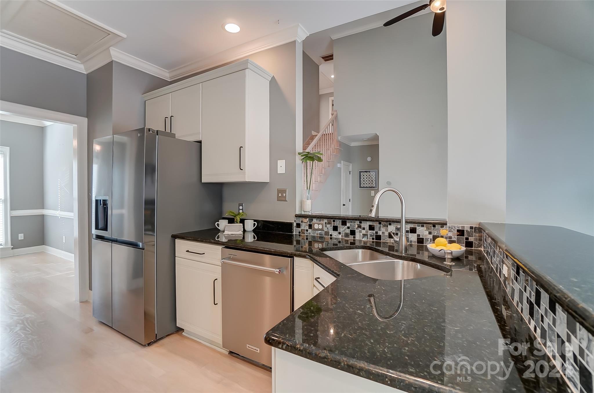 657 Portpatrick Place Fort Mill, SC 29708 - Photo 15 of 46 a kitchen with stainless steel appliances granite countertop a sink a stove and a refrigerator