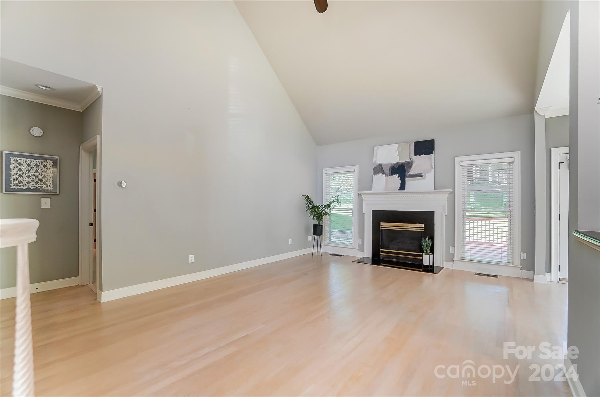 657 Portpatrick Place Fort Mill, SC 29708 - Photo 18 of 46 a view of an empty room with a fireplace and a window