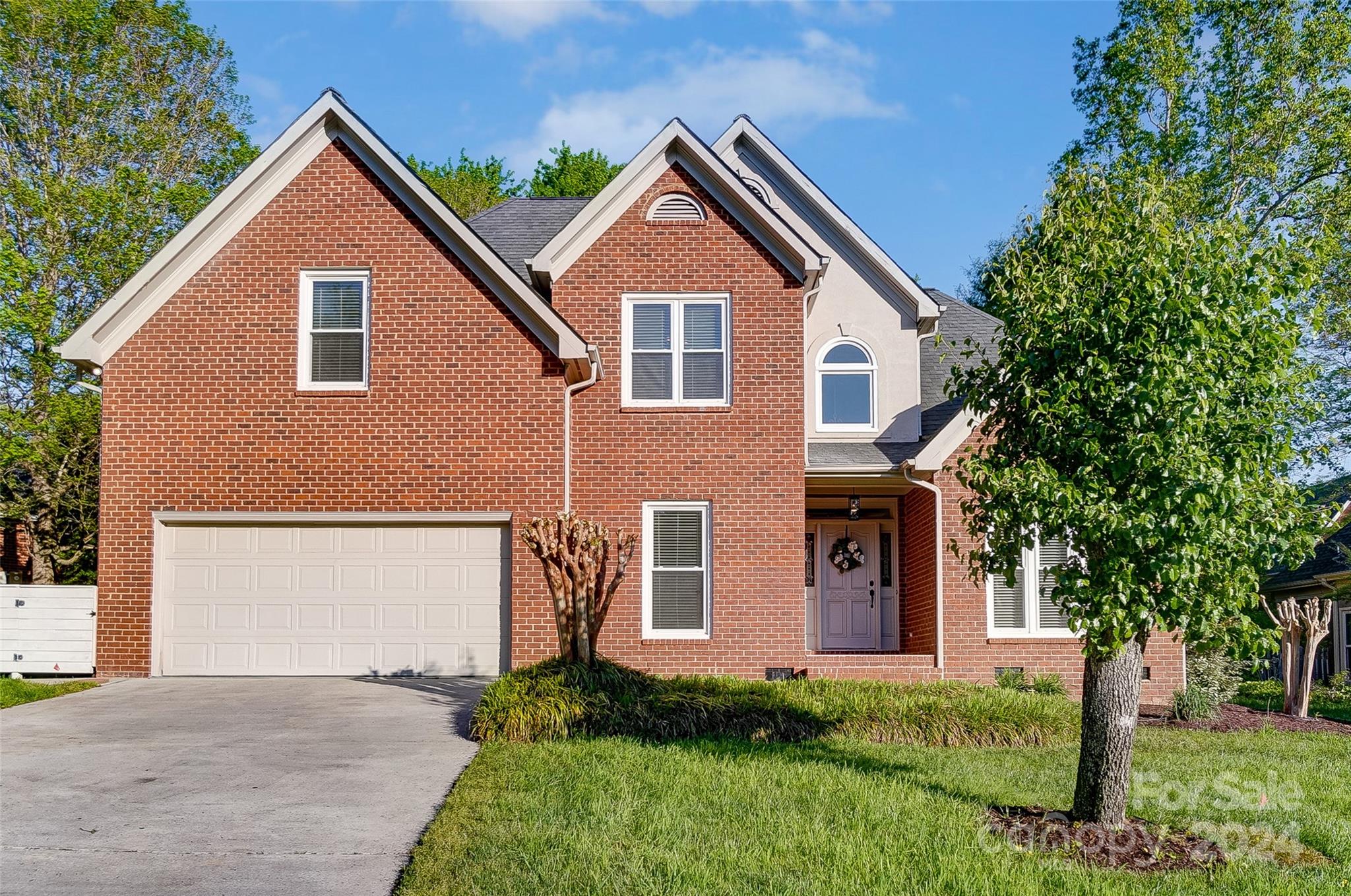 657 Portpatrick Place Fort Mill, SC 29708 - Photo 2 of 46 a front view of a house with a yard and garage